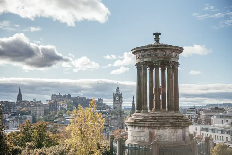 Dugald Stewart Monument on Calton Hill with the Edinburgh Old Town skyline behind
