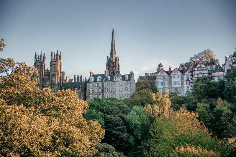 Old Town spires and the New College towers rising above autumn trees