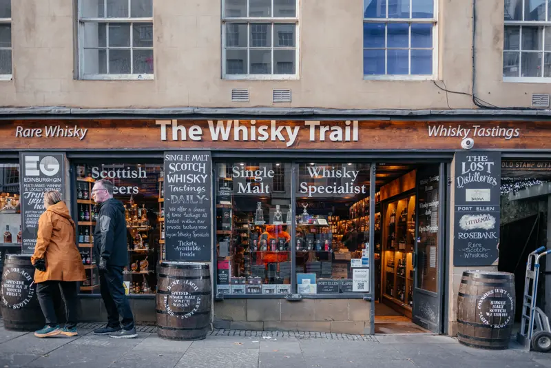 A whisky specialist shopfront on an Old Town street in Edinburgh